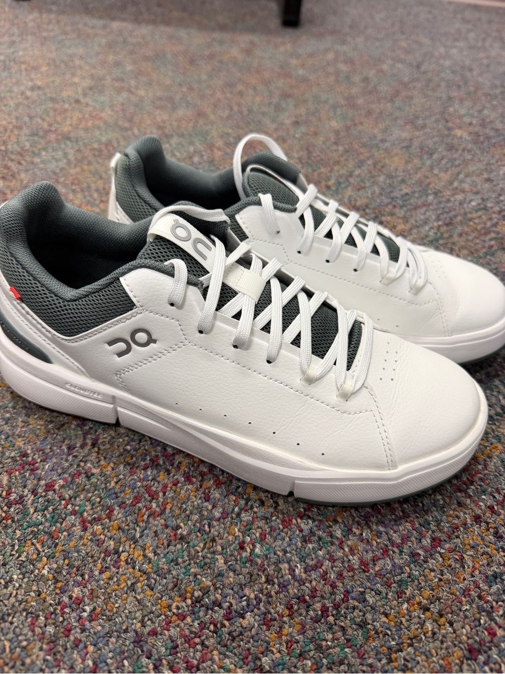 On Running White and Olive Roger Sneakers